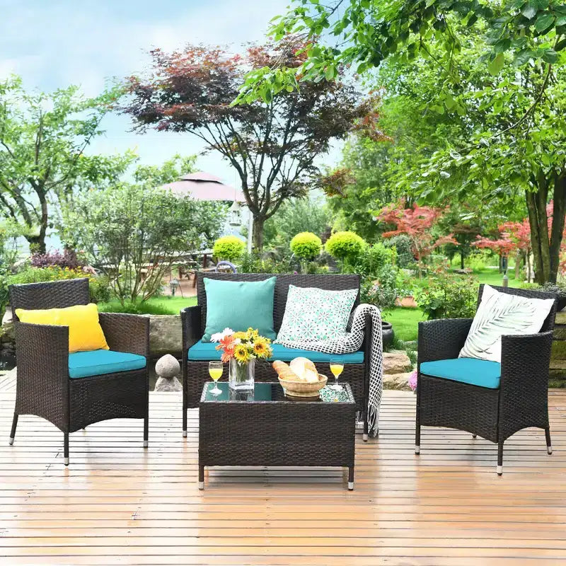 Set Mobili da Giardino 4 Pezzi in Rattan con Tavolo Scaffale Divano e Cuscini Turchese/Rosso/Grigio Costway
