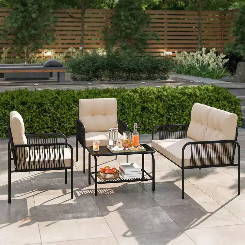 Set di mobili da giardino Costway 4 pezzi con divanetto, tavolino da caffè in vetro temperato e cuscini morbidi