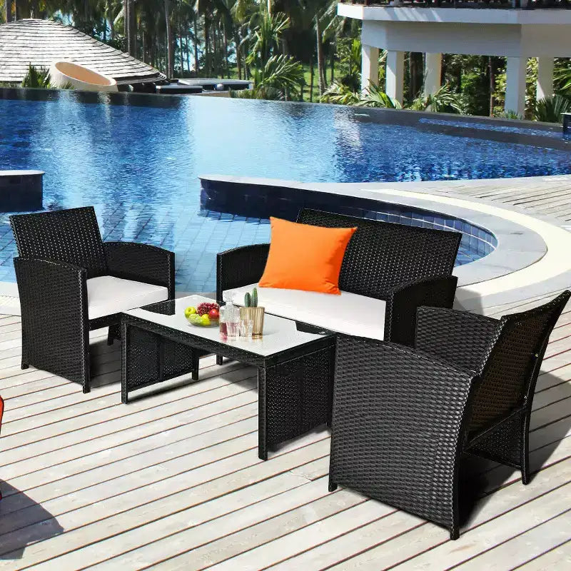 Set di mobili da conversazione per patio in rattan e vimini Costway 4 pezzi con divano imbottito e tavolo