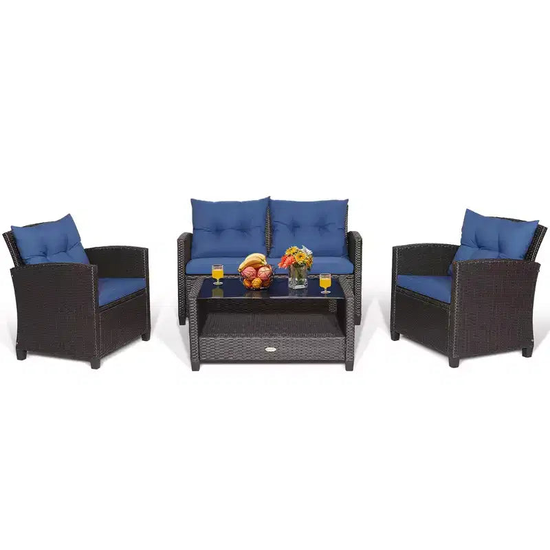 Set di mobili da giardino in rattan a 4 pezzi Costway con tavolo in vetro, scaffale e cuscini per divano