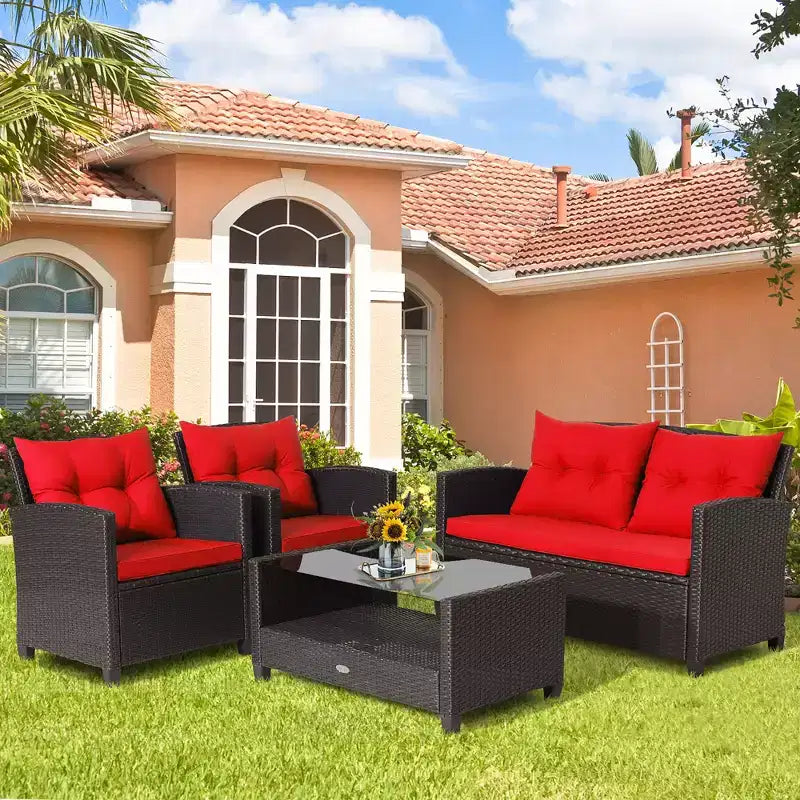 Set di mobili da giardino in rattan a 4 pezzi Costway con tavolo in vetro, scaffale e cuscini per divano