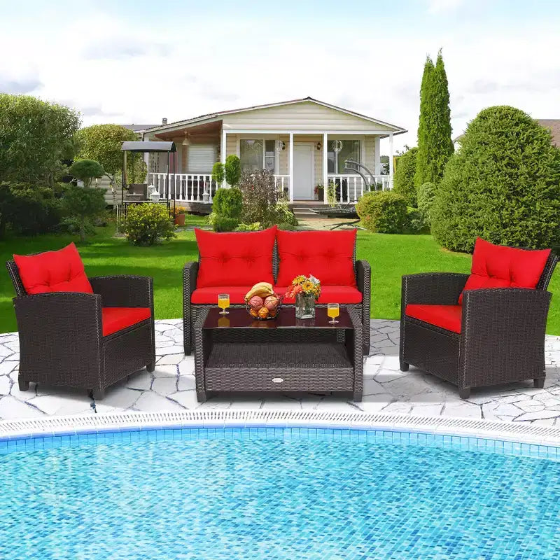 Set di mobili da giardino in rattan a 4 pezzi Costway con tavolo in vetro, scaffale e cuscini per divano