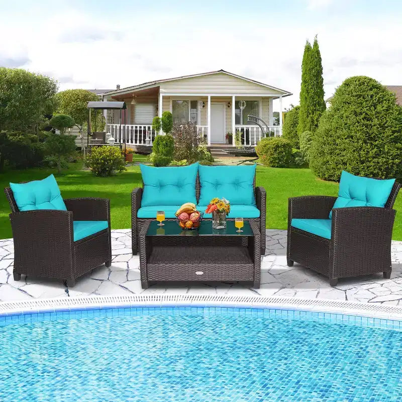 Set di mobili da giardino in rattan a 4 pezzi Costway con tavolo in vetro, scaffale e cuscini per divano